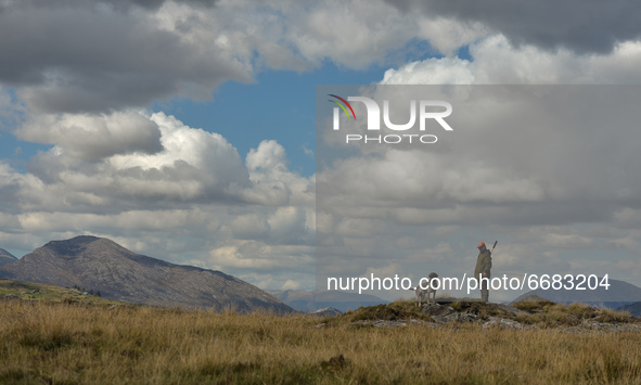 Father Krzysztof Sikora cuts the grass around the 'Our Lady Star Of The Sea' Roman Catholic church in Roundstone, Connemara.

Geographically...