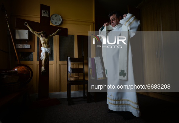 Father Krzysztof Sikora is getting ready for private prayer at the closed Roman Catholic Church 'Our Lady Star Of The Sea' in Roundstone. Du...