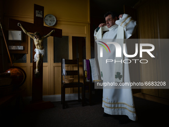 Father Krzysztof Sikora is getting ready for private prayer at the closed Roman Catholic Church 'Our Lady Star Of The Sea' in Roundstone. Du...