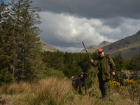 Father Krzysztof Sikora walks his dog 'Rambo' near Barnanoraun townland, near the Owenglin River.

Geographically, Roundstone parish is cons...