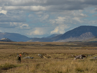 Father Krzysztof Sikora walks his dog 'Rambo' near to the Gowla Fishery, situated in central Connemara, among one of the most beautiful and...