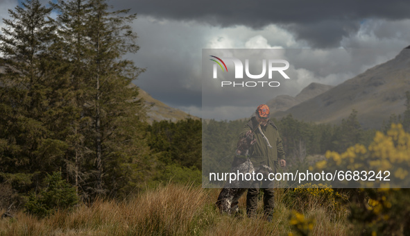 Father Krzysztof Sikora walks his dog 'Rambo' near Barnanoraun townland, near the Owenglin River.

Geographically, Roundstone parish is cons...