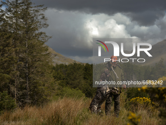 Father Krzysztof Sikora walks his dog 'Rambo' near Barnanoraun townland, near the Owenglin River.

Geographically, Roundstone parish is cons...