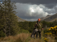 Father Krzysztof Sikora walks his dog 'Rambo' near Barnanoraun townland, near the Owenglin River.

Geographically, Roundstone parish is cons...