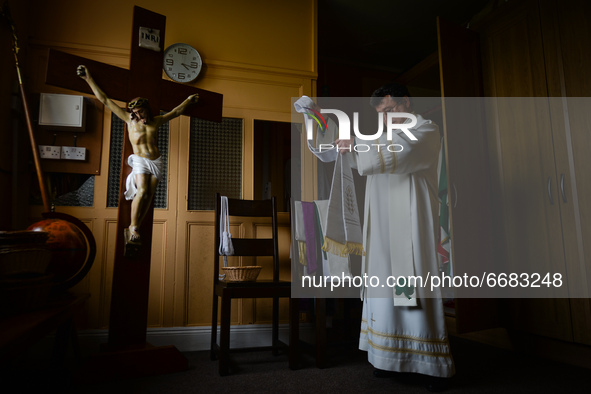 Father Krzysztof Sikora is getting ready for private prayer at the closed Roman Catholic Church 'Our Lady Star Of The Sea' in Roundstone. Du...