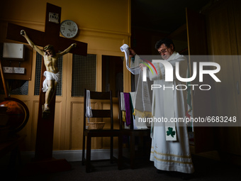 Father Krzysztof Sikora is getting ready for private prayer at the closed Roman Catholic Church 'Our Lady Star Of The Sea' in Roundstone. Du...