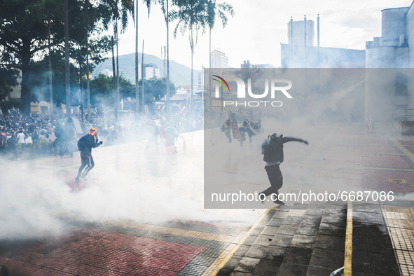 Demonstrators clash with riot police during a protest against President Ivan Duque's government in Pereira, Colombia on May 05, 2021. 