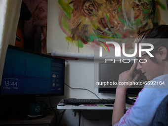 Chelsea Jacobs aka Chels, an American artist living in Dublin, gets ready to work in front of the computer after lunch break while working o...