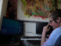 Chelsea Jacobs aka Chels, an American artist living in Dublin, gets ready to work in front of the computer after lunch break while working o...