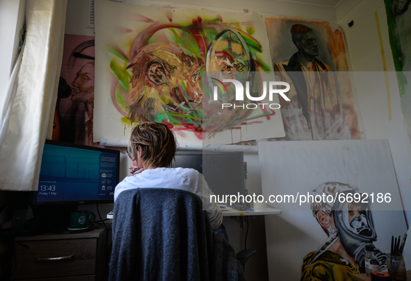 Chelsea Jacobs aka Chels, an American artist living in Dublin, gets ready to work in front of the computer after lunch break while working o...