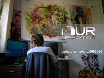 Chelsea Jacobs aka Chels, an American artist living in Dublin, gets ready to work in front of the computer after lunch break while working o...