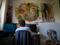 Chelsea Jacobs aka Chels, an American artist living in Dublin, gets ready to work in front of the computer after lunch break while working o...