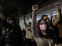 Demonstrators raise their fists at ground zero on Tláhuac Avenue after the collapse of Metro line 12 on the night of May 3 between Tezonco a...