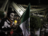 A person dressed as a skull at ground zero on Tláhuac Avenue after the collapse of Metro line 12 on the night of May 3 between Tezonco and O...