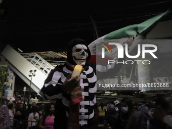 A person dressed as a skull at ground zero on Tláhuac Avenue after the collapse of Metro line 12 on the night of May 3 between Tezonco and O...