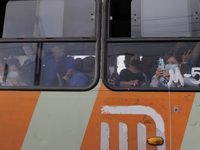 A public transport user films demonstrators near the collapse of Metro line 12 on the night of May 3 between Tezonco and Olivos stations in...