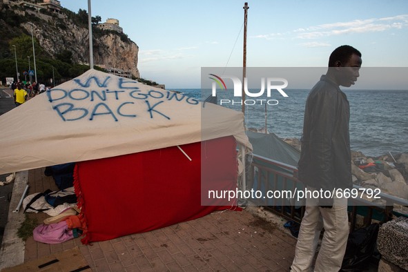 A tent with written "We don't going to Back", in Ventimiglia, on the French-Italian border, on June 23, 2015. The situation of migrants camp...