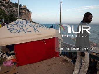 A tent with written "We don't going to Back", in Ventimiglia, on the French-Italian border, on June 23, 2015. The situation of migrants camp...