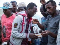 A migrant eat at the end of Ramadan, in Ventimiglia, on the French-Italian border, on June 23, 2015. The situation of migrants camped in Ven...