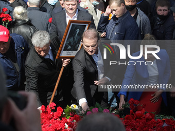 Viktor Medvedchuk, a leader of Opposition Platform-For life, (C) lays flowers to the Monument of Eternal Glory on the Tomb of the Unknown So...