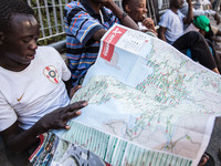 A migrant with Italy maps, in Ventimiglia, on June 24, 2015.  The situation of migrants camped in Ventimiglia has not changed except for the...