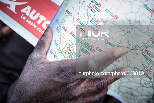 A migrant with Italy maps, in Ventimiglia, on June 24, 2015.  The situation of migrants camped in Ventimiglia has not changed except for the...