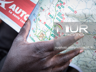 A migrant with Italy maps, in Ventimiglia, on June 24, 2015.  The situation of migrants camped in Ventimiglia has not changed except for the...