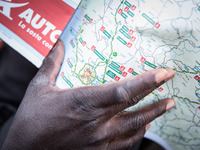 A migrant with Italy maps, in Ventimiglia, on June 24, 2015.  The situation of migrants camped in Ventimiglia has not changed except for the...