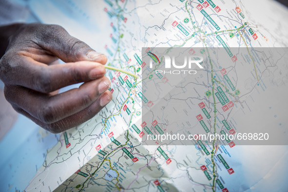 A migrant with Italy maps, in Ventimiglia, on June 24, 2015.  The situation of migrants camped in Ventimiglia has not changed except for the...