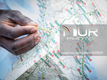 A migrant with Italy maps, in Ventimiglia, on June 24, 2015.  The situation of migrants camped in Ventimiglia has not changed except for the...