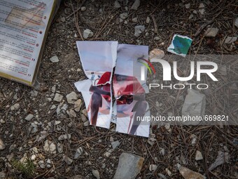 Photo torn at the "trail of death", there are several remnants of recent migrants from the trail, in Ventimiglia at the French-Italian borde...