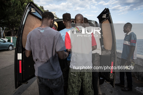 Clothes and shoes are distributed by volunteers of associations and citizens, in the city of Ventimiglia at the French-Italian border, on Ju...