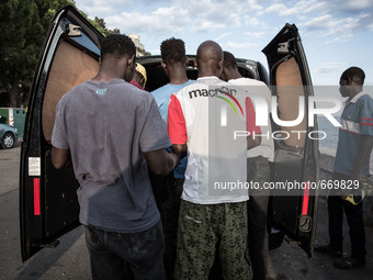 Clothes and shoes are distributed by volunteers of associations and citizens, in the city of Ventimiglia at the French-Italian border, on Ju...