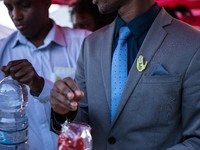 A man with brooch pin written "Touch Pas a Mon Pote" (Don't Touch My friend), in the city of Ventimiglia at the French-Italian border, on Ju...