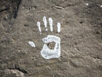 An art installation of Vauro on the rocks where migrants are, in the city of Ventimiglia at the French-Italian border, on June 25, 2015. The...