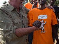 Vauro (L) famous political cartoonist, made an art installation on the rocks where migrants are, in Ventimiglia on June 25, 2015. The situat...