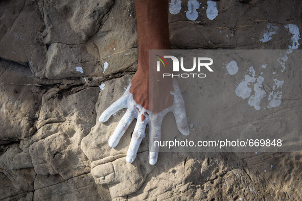 An art installation of Vauro on the rocks where migrants are, in the city of Ventimiglia at the French-Italian border, on June 25, 2015. The...