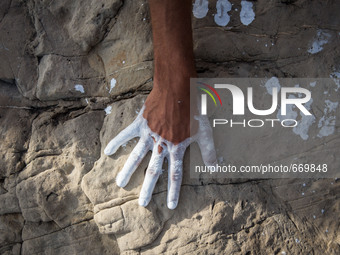 An art installation of Vauro on the rocks where migrants are, in the city of Ventimiglia at the French-Italian border, on June 25, 2015. The...