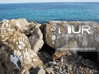 Handprints (an art installation of Vauro) on the rocks where migrants are, in the city of Ventimiglia at the French-Italian border, on June...