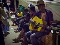 Migrants plays near the rocks where they sleep, in Ventimiglia, on June 27, 2015. The situation of migrants camped in Ventimiglia has not ch...