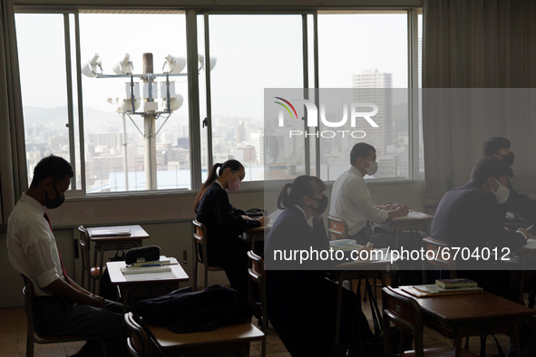 Buildings of Hiroshima downtown are viewed through classroom windows as students attend a lecture at Hiroshima Korean School on May 9, 2021...