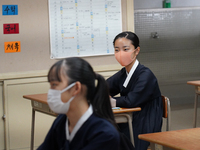 Students wearing face masks stay seated at their desks during a lecture at Hiroshima Korean School on May 9, 2021 in Hiroshima, Japan. The s...