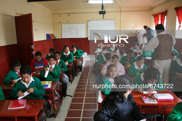 Students from a primary school in Mexico receive classes during the back-to-school period to continue their studies in Mexico City, Mexico ,...