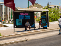 A man is watching the protesters in Athens, Greece, on May 27, 2021. (