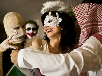 The balmasque home party where people are having fun, drink alcohol, kiss and dance. (