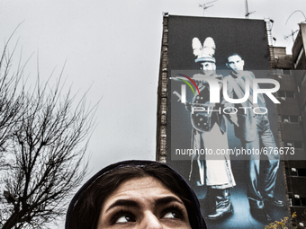 Symbolic portrait of young woman that looks at the old govermental painting of the well known enemies. (