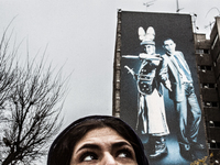 Symbolic portrait of young woman that looks at the old govermental painting of the well known enemies. (