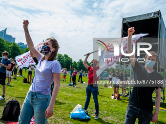 Students are raising their hands in the air, during the Nationwide student strike, organized in The Hague, Netherlands on June 3rd, 2021. (