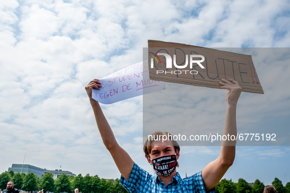 A student is holding placards against Mark Rutte, during the Nationwide student strike, organized in The Hague, Netherlands on June 3rd, 202...