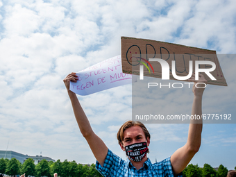 A student is holding placards against Mark Rutte, during the Nationwide student strike, organized in The Hague, Netherlands on June 3rd, 202...